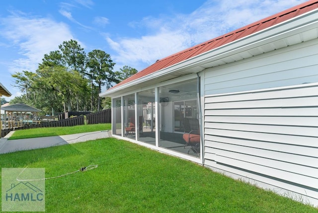 view of yard with a sunroom