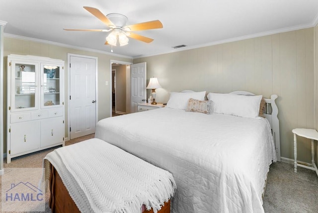 bedroom with light carpet, ceiling fan, and ornamental molding