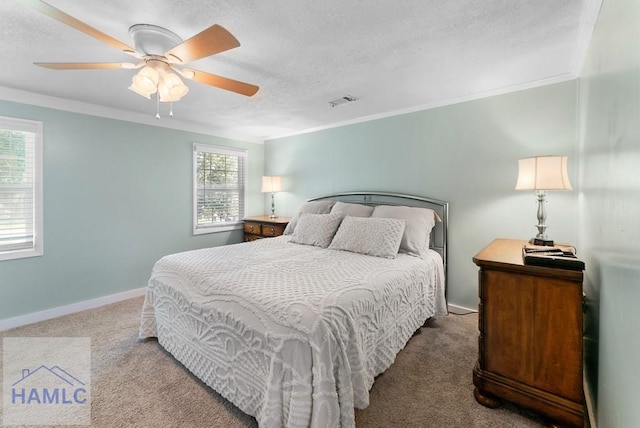 bedroom with multiple windows, ceiling fan, and carpet