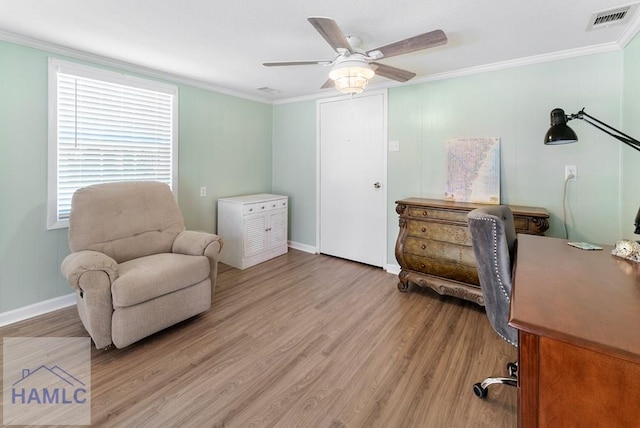 living area with ceiling fan, light hardwood / wood-style floors, and ornamental molding