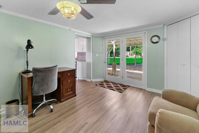 office area with ceiling fan, light hardwood / wood-style floors, and ornamental molding