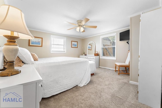 carpeted bedroom featuring ceiling fan and ornamental molding