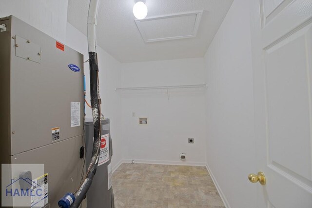 1 Blackberry Ln, Port Wentworth, GA 31407 - laundry room with heating unit, water heater, washer hookup, and attic access