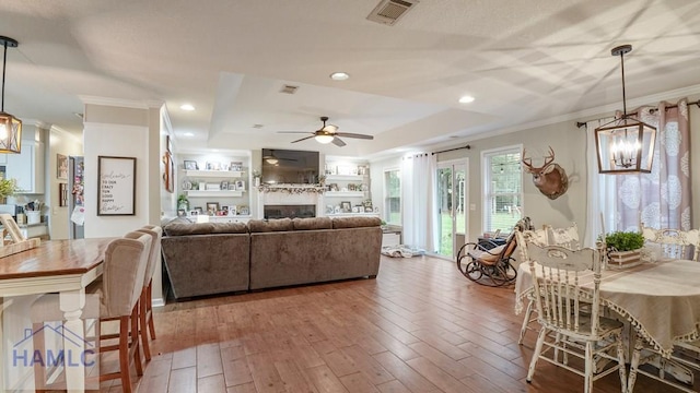 705 S 11th St, Jesup, GA 31545 - dining area with ornamental molding, a ceiling fan, hardwood / wood-style floors, recessed lighting, and a fireplace