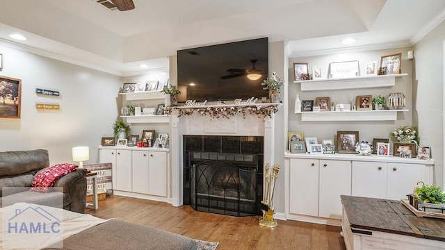 705 S 11th St, Jesup, GA 31545 - living area with ornamental molding, light wood finished floors, recessed lighting, a ceiling fan, and a tiled fireplace