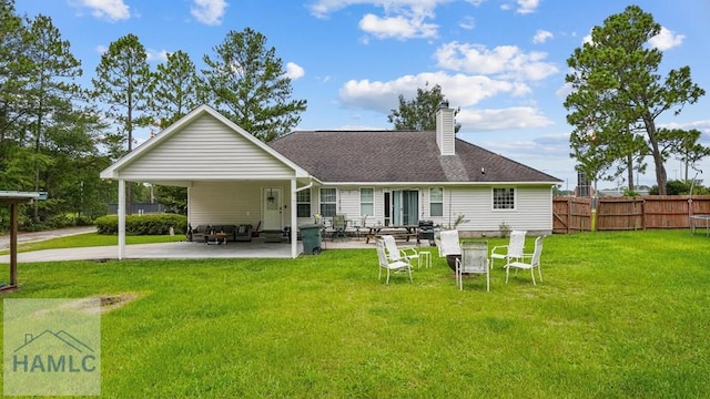 705 S 11th St, Jesup, GA 31545 - rear view of property with a carport, a chimney, a patio, and concrete driveway