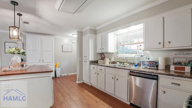 705 S 11th St, Jesup, GA 31545 - kitchen with stainless steel dishwasher, crown molding, white cabinets, hanging light fixtures, and light wood finished floors