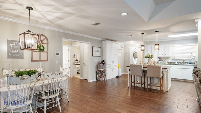 705 S 11th St, Jesup, GA 31545 - dining space with ornamental molding, a chandelier, dark wood-style floors, and recessed lighting