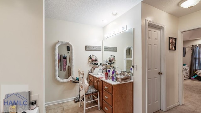 705 S 11th St, Jesup, GA 31545 - bathroom with a textured ceiling, vanity, and tile patterned floors