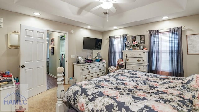 705 S 11th St, Jesup, GA 31545 - bedroom with light carpet, recessed lighting, a ceiling fan, and a tray ceiling