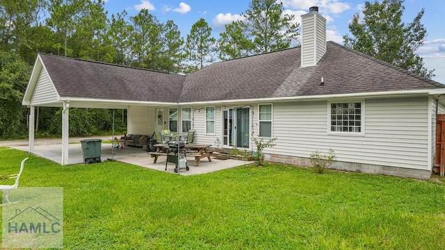 705 S 11th St, Jesup, GA 31545 - rear view of property featuring a chimney, roof with shingles, a yard, and a patio area