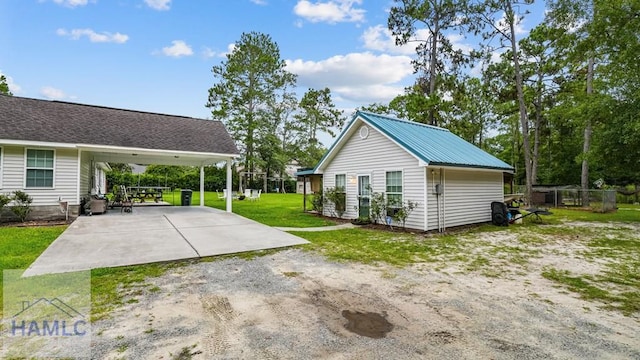 705 S 11th St, Jesup, GA 31545 - exterior space with driveway and a carport