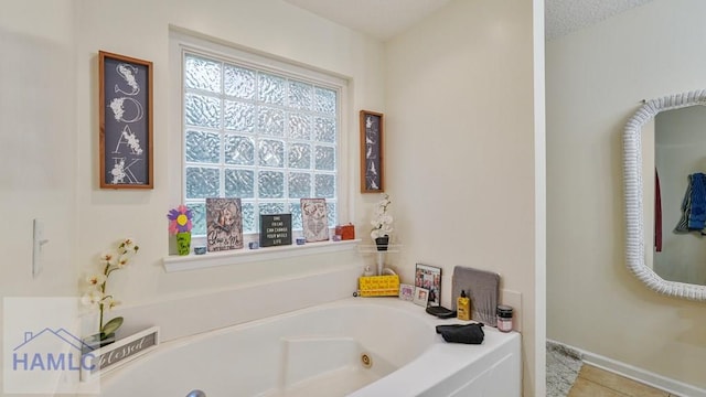705 S 11th St, Jesup, GA 31545 - full bathroom featuring a jetted tub and tile patterned floors