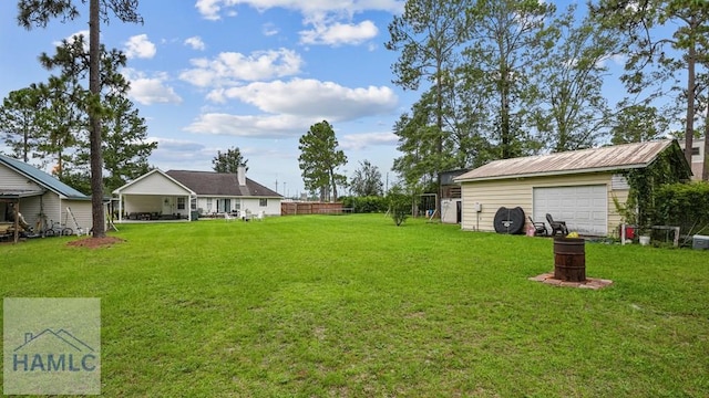 705 S 11th St, Jesup, GA 31545 - view of green lawn with an outbuilding and a garage