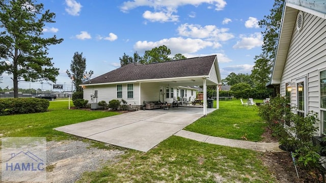 705 S 11th St, Jesup, GA 31545 - rear view of house featuring driveway, a carport, and a lawn