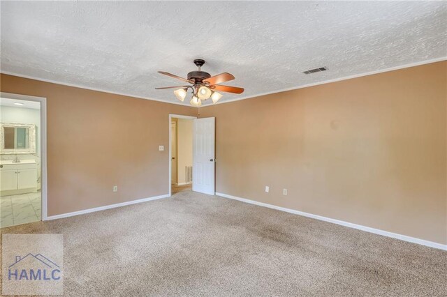 105N Bay St, Jesup, GA 31545 - carpeted spare room with a ceiling fan, a sink, baseboards, a textured ceiling, and crown molding