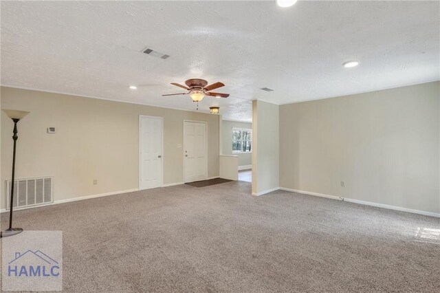 105N Bay St, Jesup, GA 31545 - carpeted empty room with a ceiling fan, a textured ceiling, baseboards, and recessed lighting
