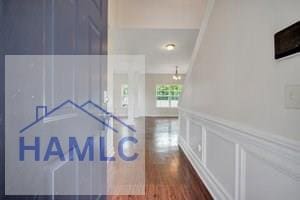 corridor with dark hardwood / wood-style floors