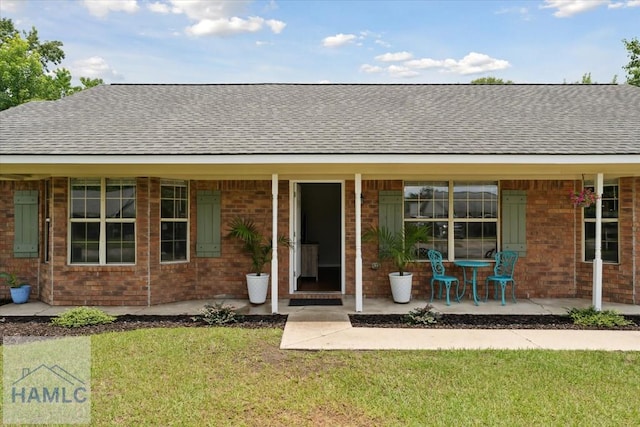 1105 Apache Aly, Hinesville, GA 31313 - view of front of house with roof with shingles, a front lawn, and brick siding