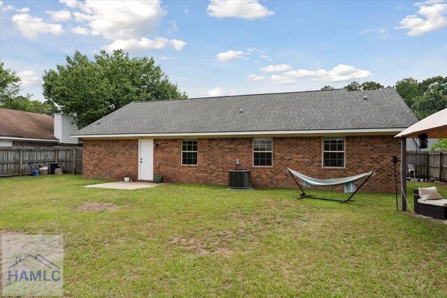 1105 Apache Aly, Hinesville, GA 31313 - rear view of house with a shingled roof and brick siding