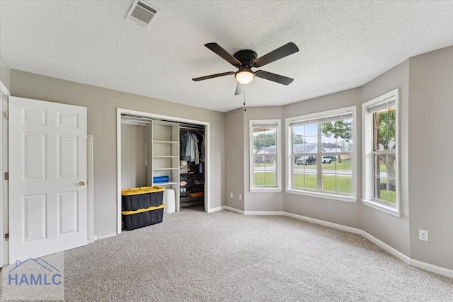 1105 Apache Aly, Hinesville, GA 31313 - unfurnished bedroom with a closet, carpet floors, a textured ceiling, and ceiling fan