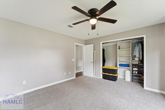 1105 Apache Aly, Hinesville, GA 31313 - unfurnished bedroom featuring carpet, a closet, and a ceiling fan