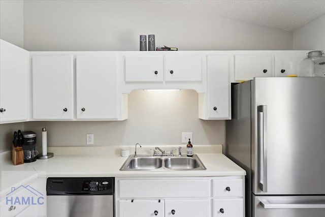 1105 Apache Aly, Hinesville, GA 31313 - kitchen with stainless steel appliances, white cabinets, light countertops, and vaulted ceiling
