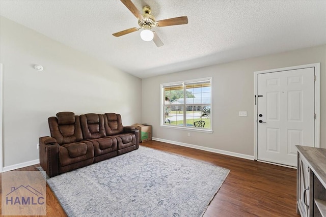 1105 Apache Aly, Hinesville, GA 31313 - living room with a ceiling fan, dark wood-style flooring, and a textured ceiling