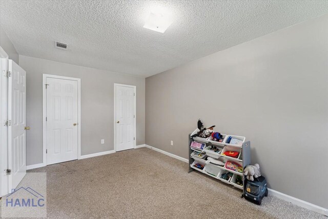 1105 Apache Aly, Hinesville, GA 31313 - game room featuring carpet flooring and a textured ceiling