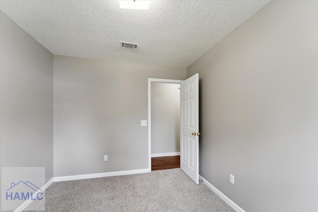 1105 Apache Aly, Hinesville, GA 31313 - spare room with carpet floors and a textured ceiling