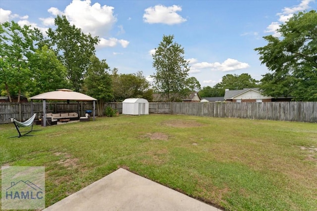 1105 Apache Aly, Hinesville, GA 31313 - fenced backyard with a gazebo, a storage unit, and a patio area