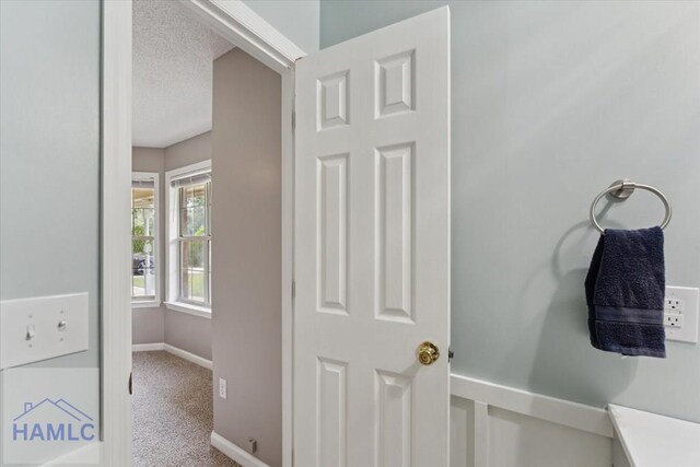 1105 Apache Aly, Hinesville, GA 31313 - bathroom featuring baseboards and a textured ceiling
