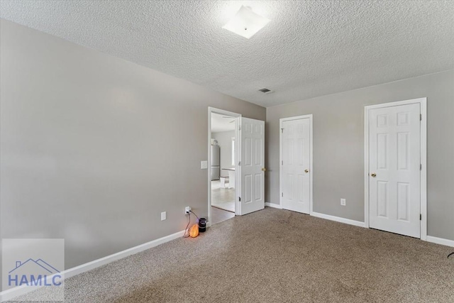 1105 Apache Aly, Hinesville, GA 31313 - unfurnished bedroom featuring carpet and a textured ceiling