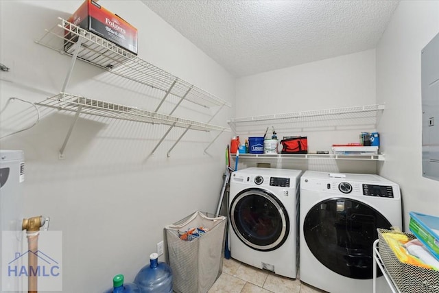 1105 Apache Aly, Hinesville, GA 31313 - laundry area with washer and dryer, tile patterned flooring, and a textured ceiling