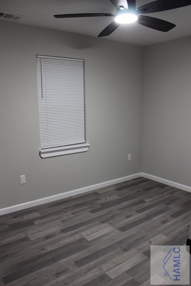 spare room featuring dark hardwood / wood-style flooring