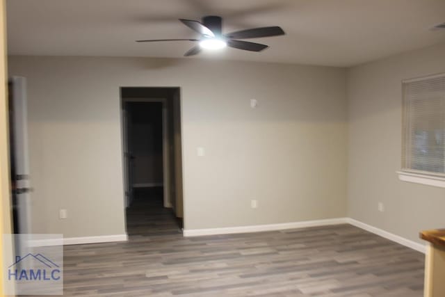 unfurnished room with ceiling fan and hardwood / wood-style flooring