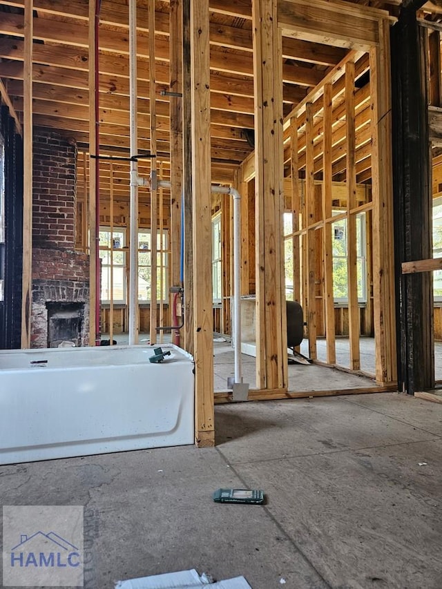 misc room featuring a wealth of natural light and a brick fireplace