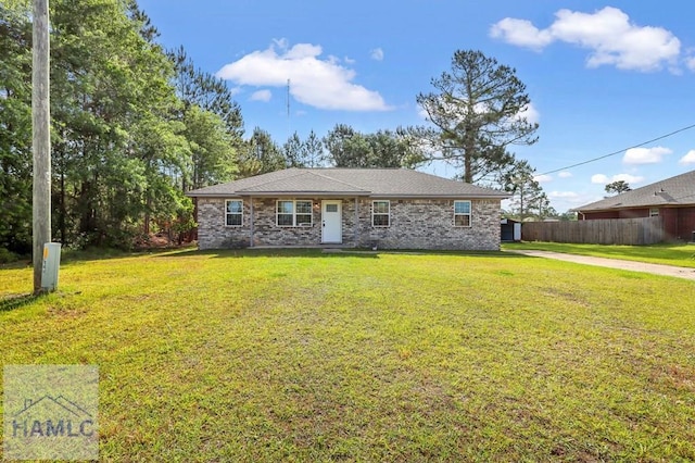 ranch-style home with fence and a front yard