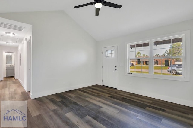 interior space featuring a healthy amount of sunlight, ceiling fan, dark wood-style floors, and lofted ceiling