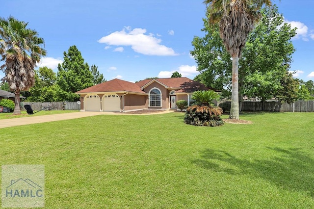 view of front facade with a front yard and a garage