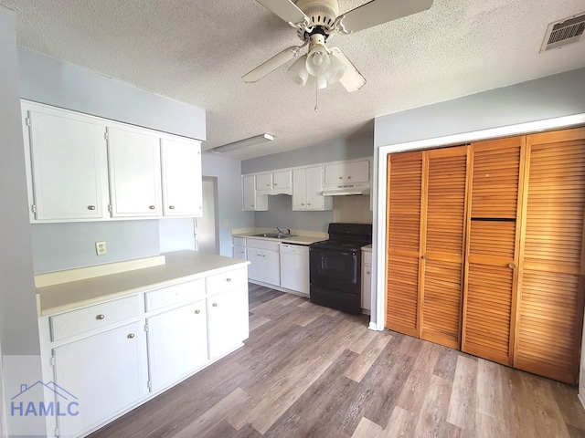 kitchen featuring a textured ceiling, dishwasher, white cabinetry, black electric range oven, and ceiling fan