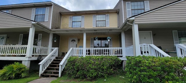 view of exterior entry with covered porch