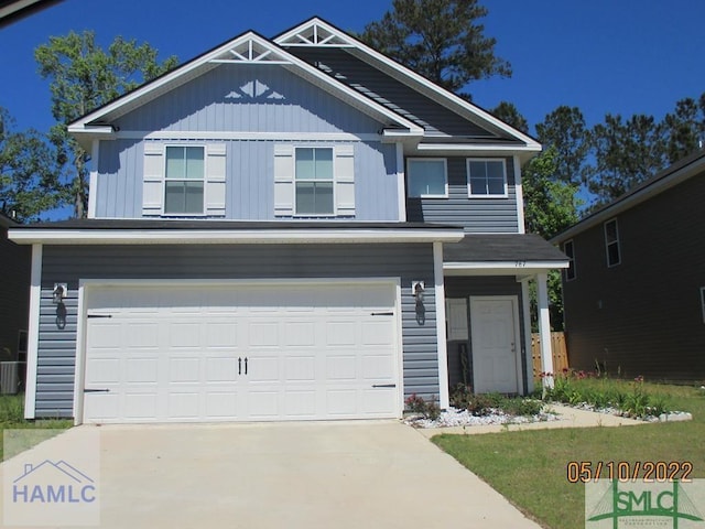 craftsman-style home featuring a garage and central AC unit