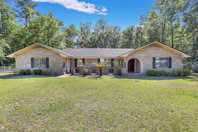 single story home featuring a front lawn