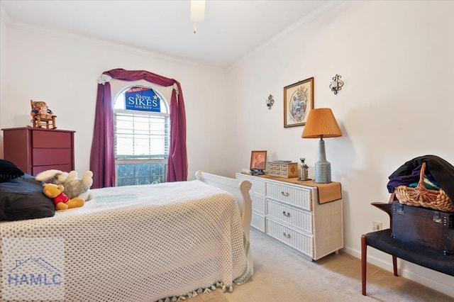 carpeted bedroom with ceiling fan and crown molding