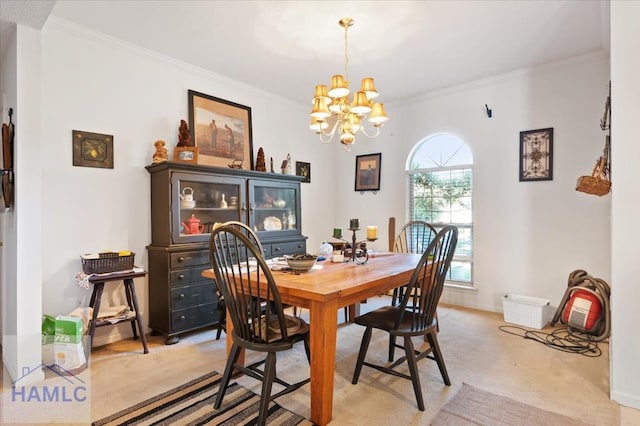 dining area with light carpet, a notable chandelier, and ornamental molding