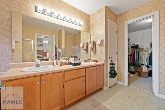 bathroom with vanity and ceiling fan