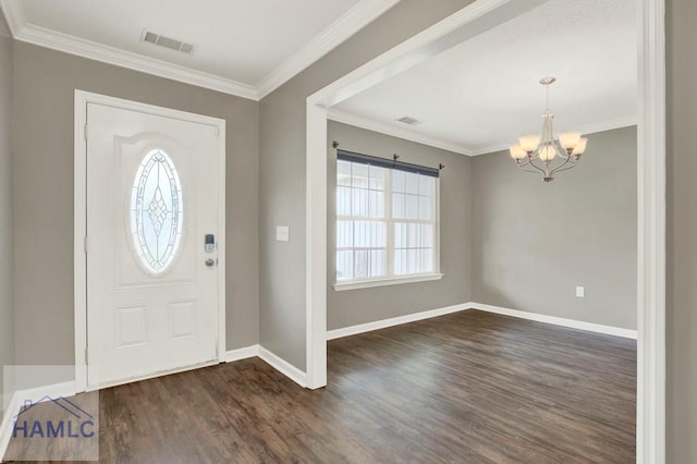 29 Joy Ln, Midway, GA 31320 - foyer entrance featuring a chandelier, dark wood-style floors, baseboards, and crown molding