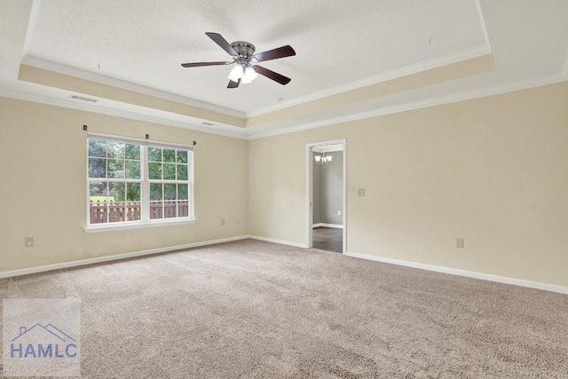 29 Joy Ln, Midway, GA 31320 - carpeted spare room featuring a tray ceiling, ornamental molding, a ceiling fan, and baseboards