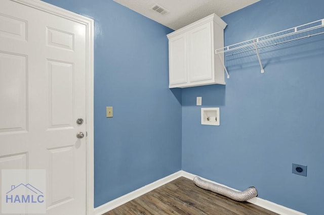 29 Joy Ln, Midway, GA 31320 - laundry room with electric dryer hookup, cabinet space, dark wood-type flooring, baseboards, and hookup for a washing machine